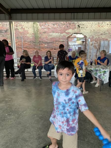 National Night Out - Boy in blue shirt enjoying festivities 