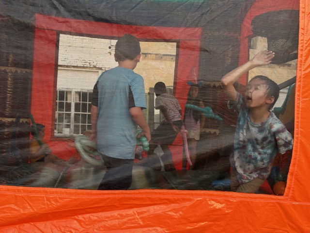children playing in bouncy house
